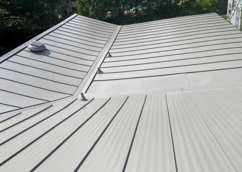 Solar attic fan installed on a metal roof for Roof Ventilation in Bernardsville